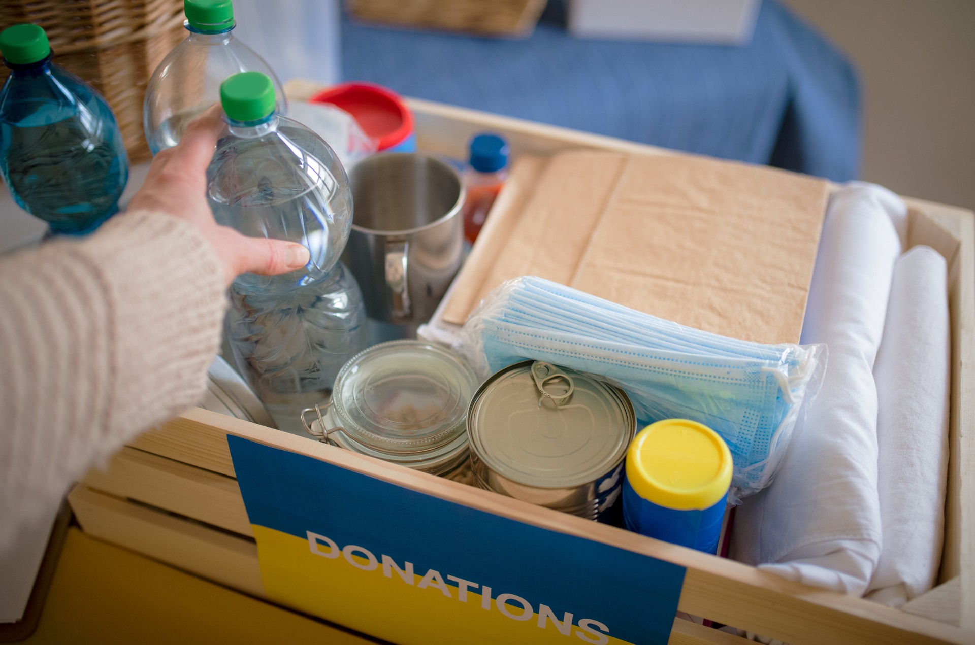 Close up of box of aid for Ukrainian refugees. Humanitarian aid concept.